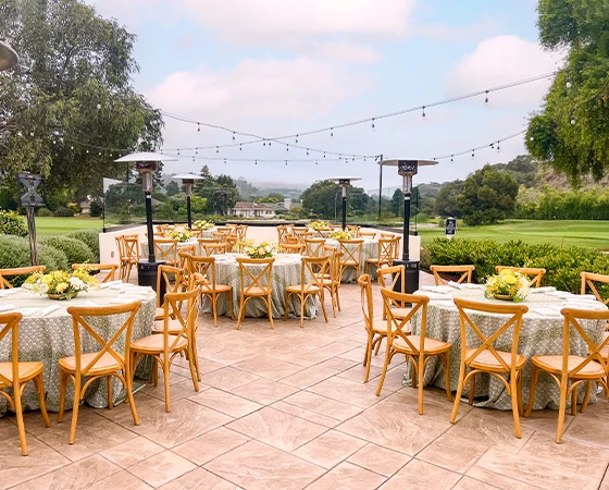 a group of tables and chairs outside