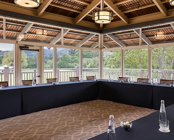 a room with a large table and chairs