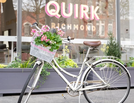 a bicycle with flowers on the front