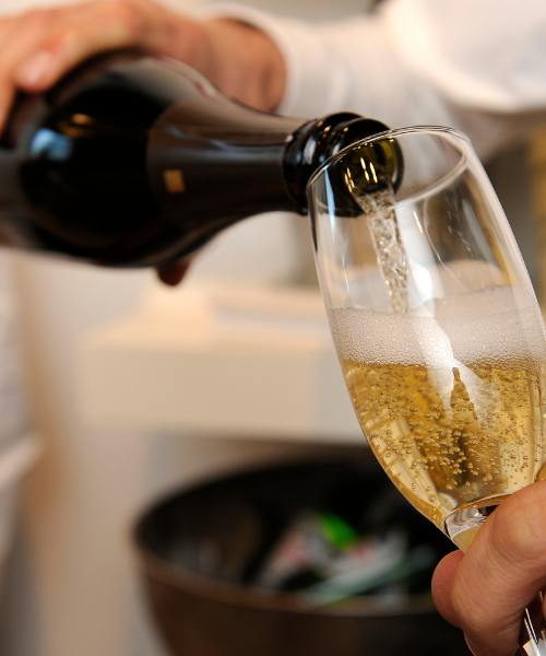 pouring champagne into a glass