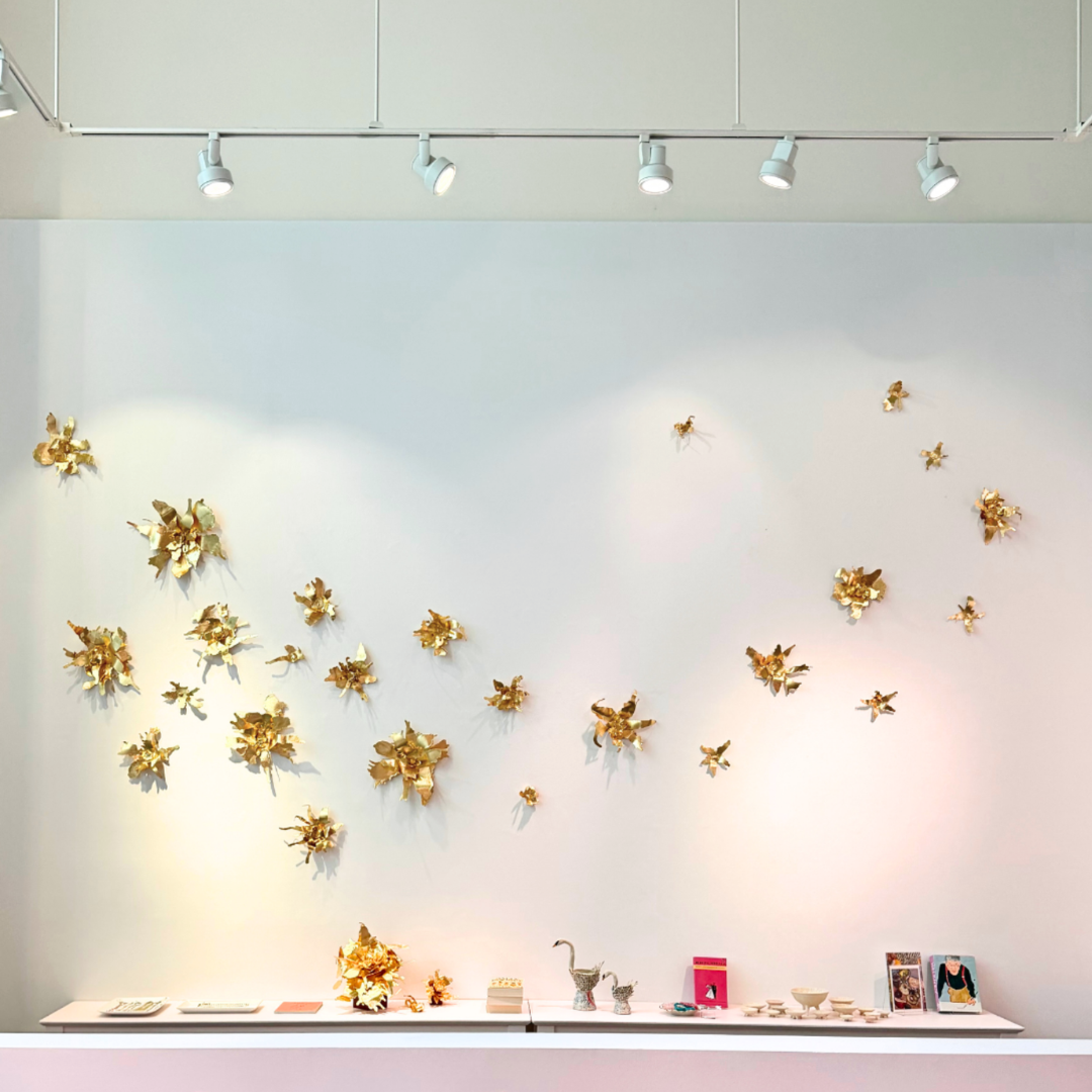 a wall with gold leaves on it