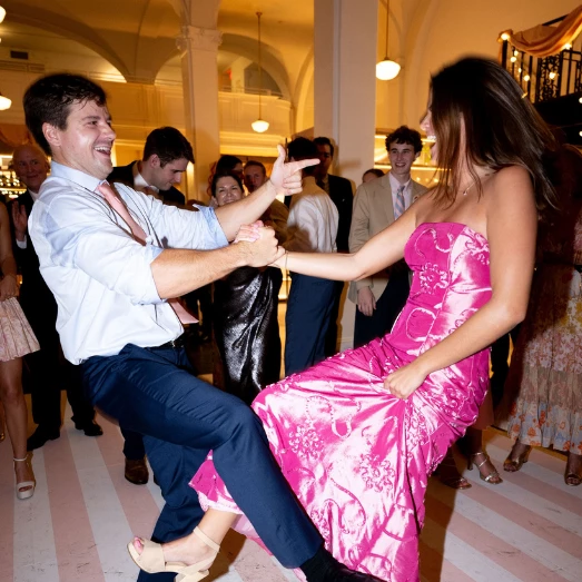 a man and woman dancing in a room