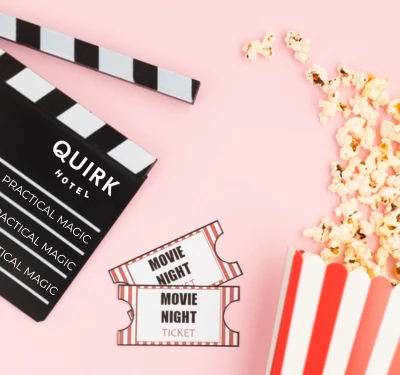 a movie clapper board and popcorn