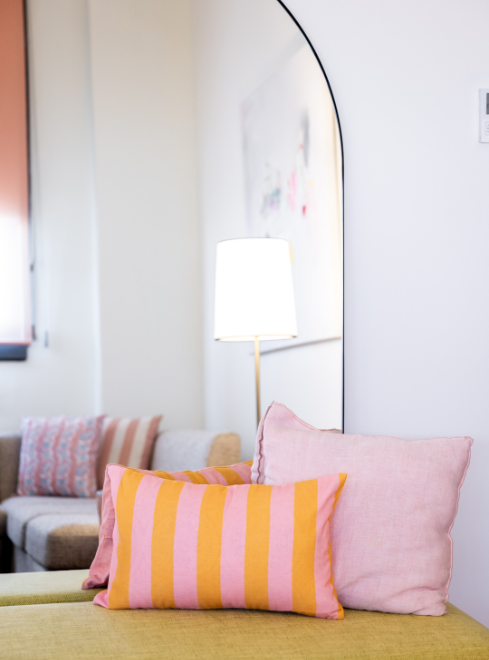 a mirror above a couch