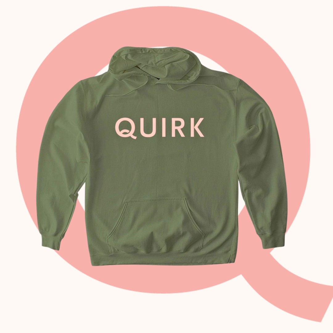 a green sweatshirt with pink Quirk on it
