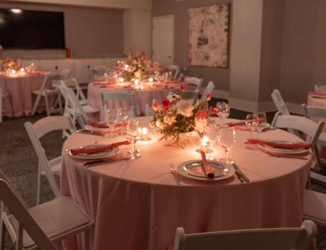 a set dining table with candles and flowers