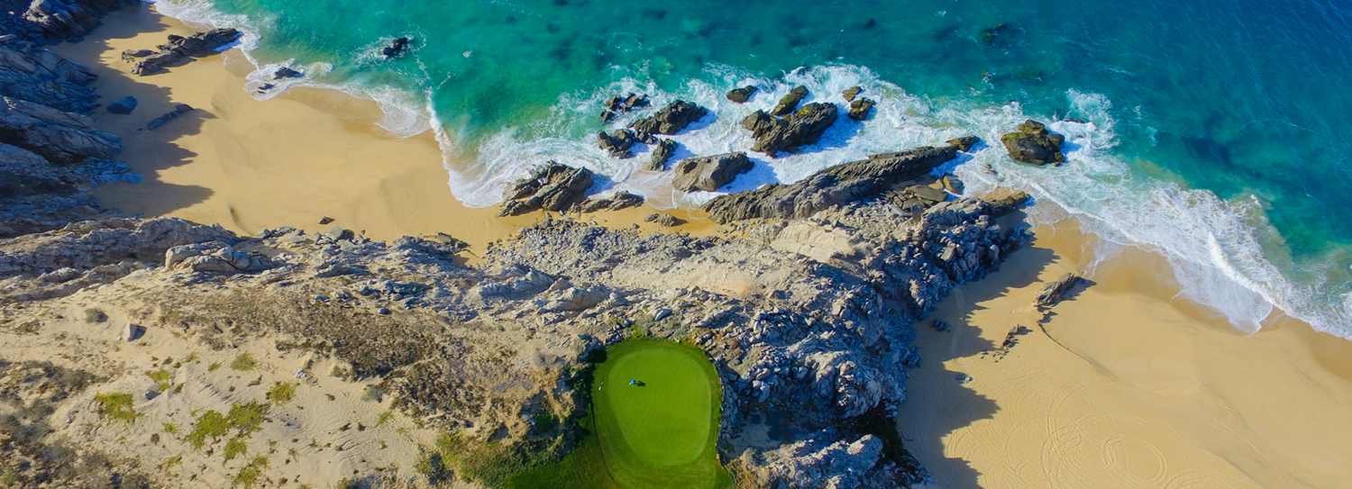 a golf course on a beach