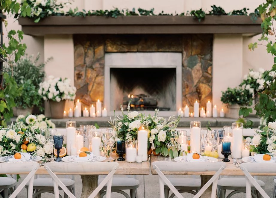 a table with candles and flowers