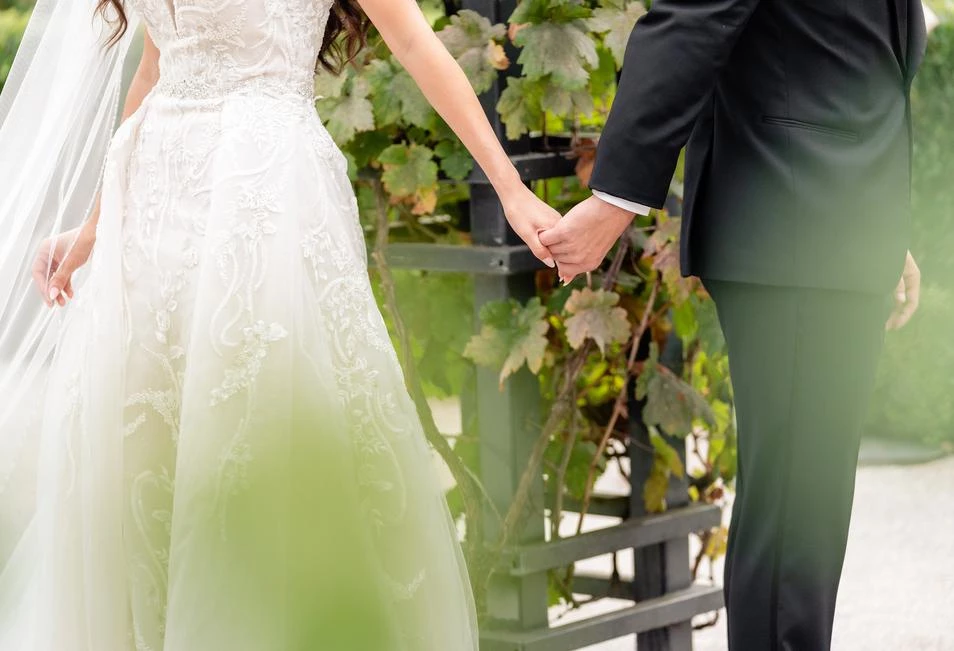 a man and woman holding hands