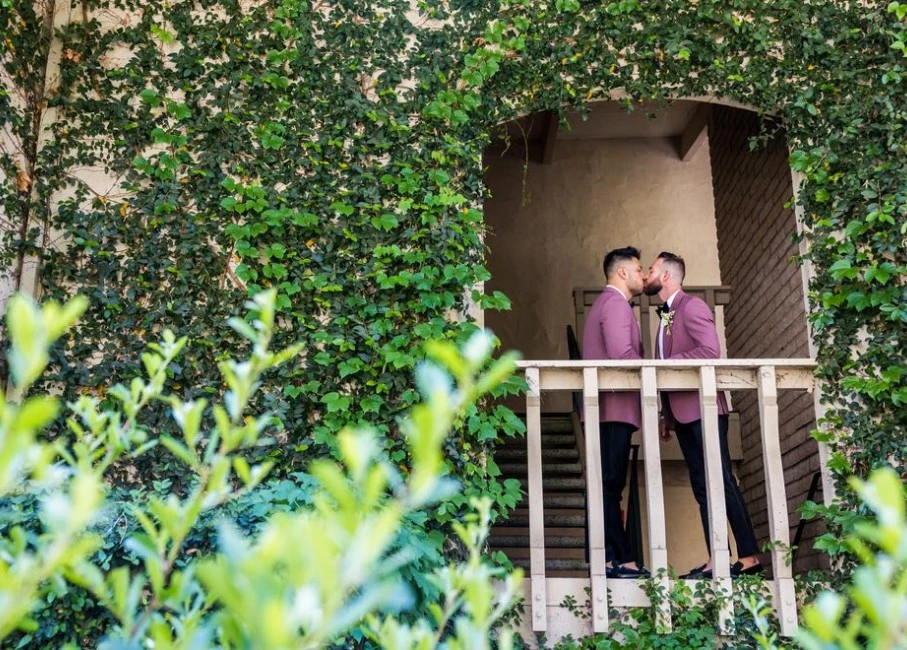 a couple of men in a small wooden house