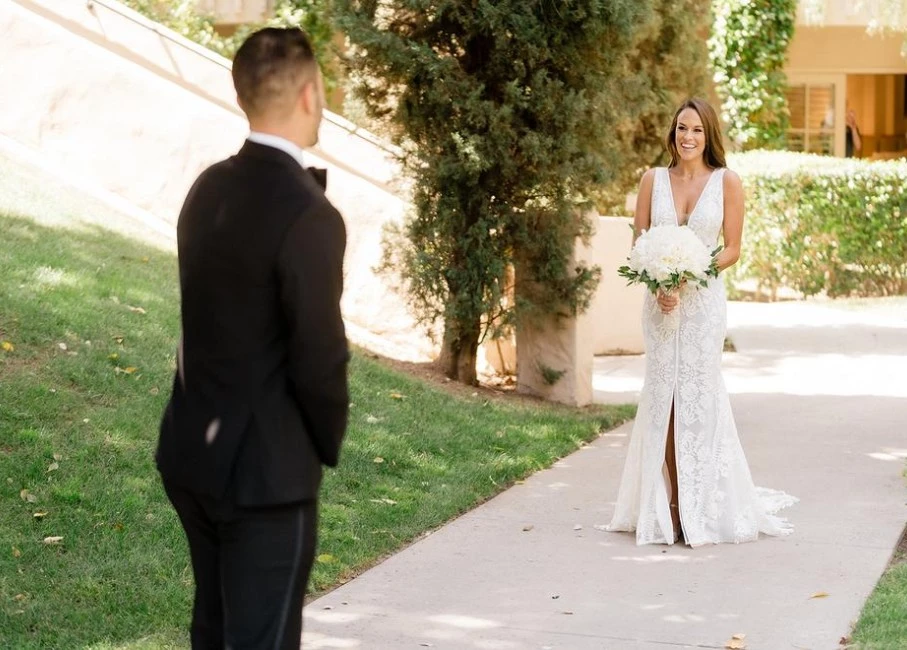 a man and woman walking down a sidewalk