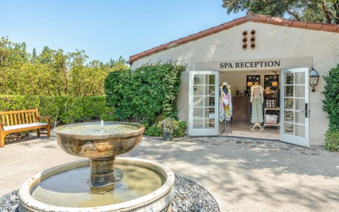 a fountain in front of a store