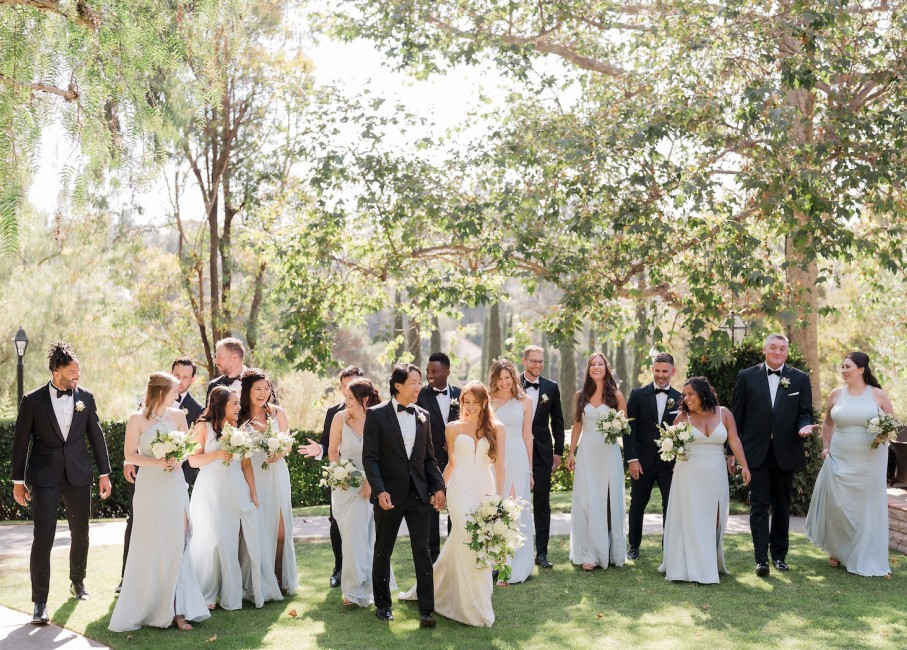 a group of people in white dresses