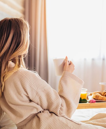 a woman sitting on a bed