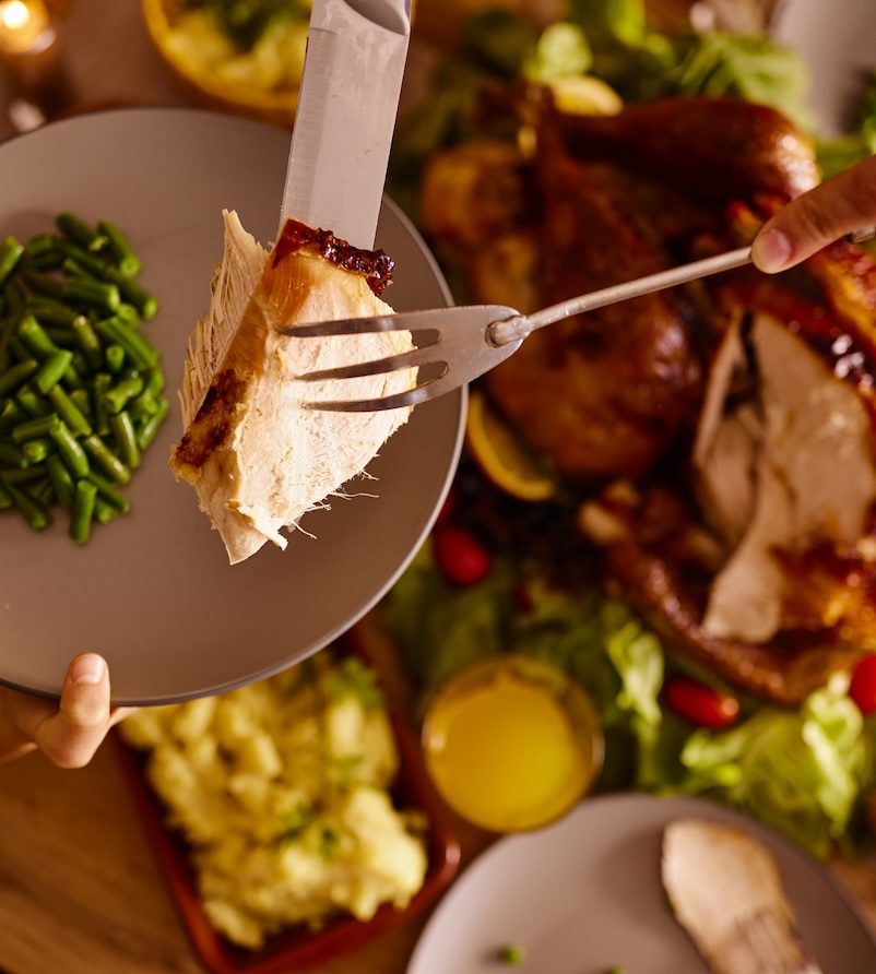 a person holding a plate of food