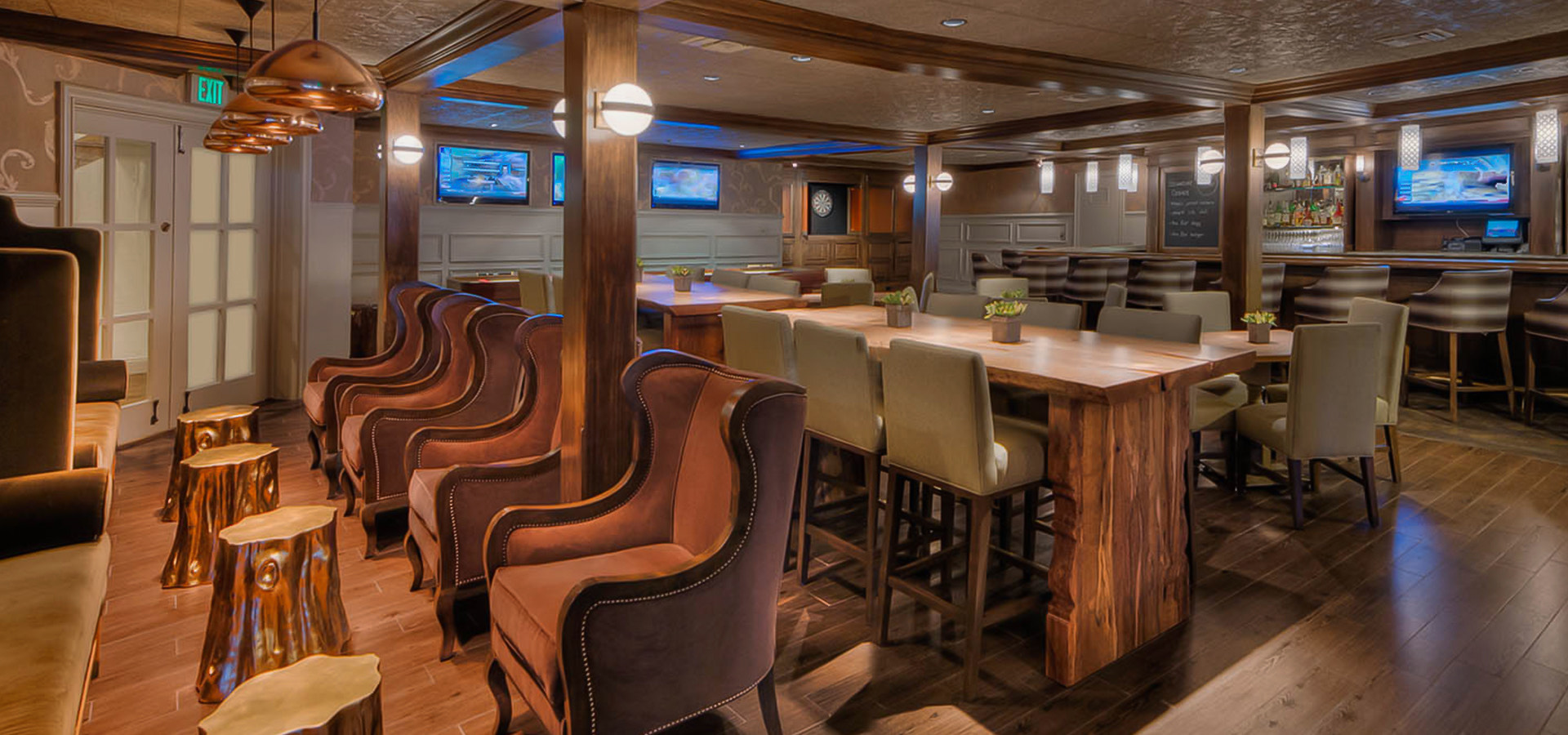 dining space with sofa chairs and long tables