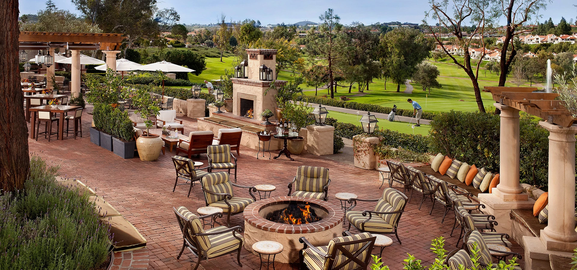 overhead view of outdoor dining area with fire pit 