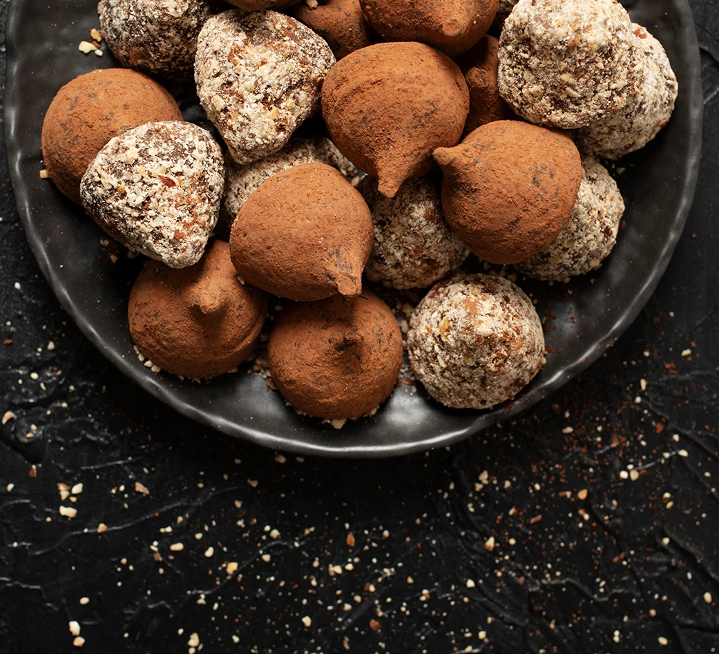 a plate of chocolate truffles