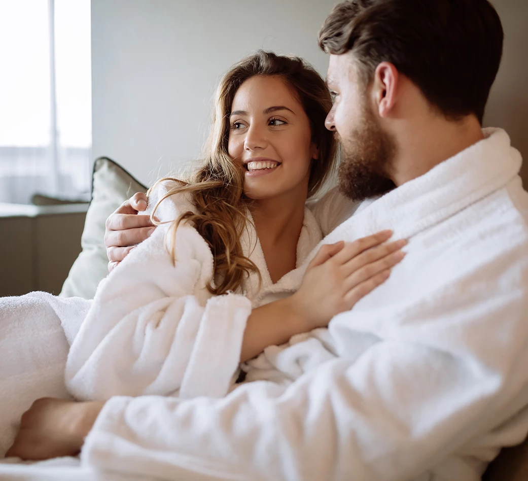 a man and woman in bathrobes