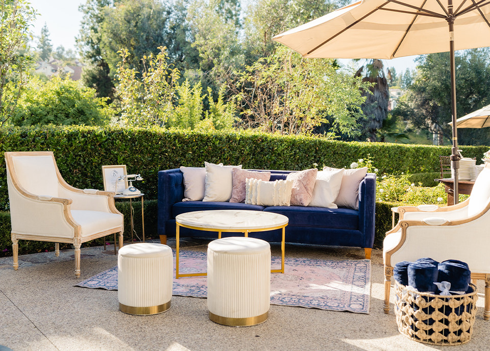 a couch and chairs outside