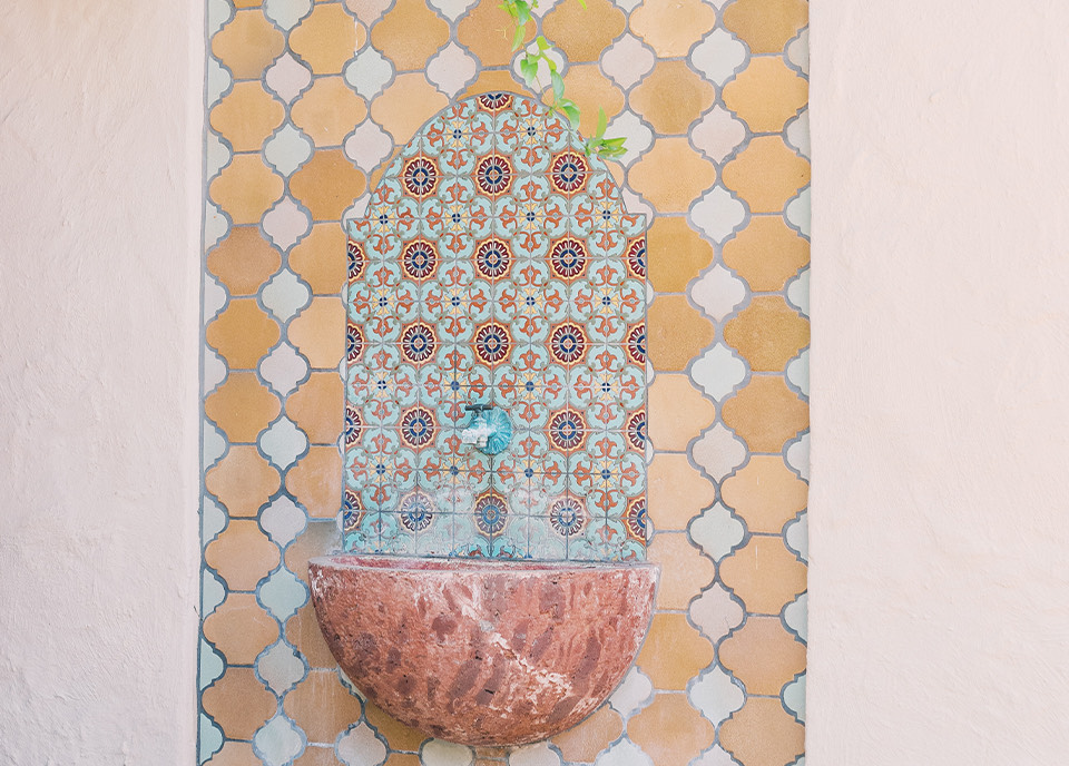 a colorful vase on a wall