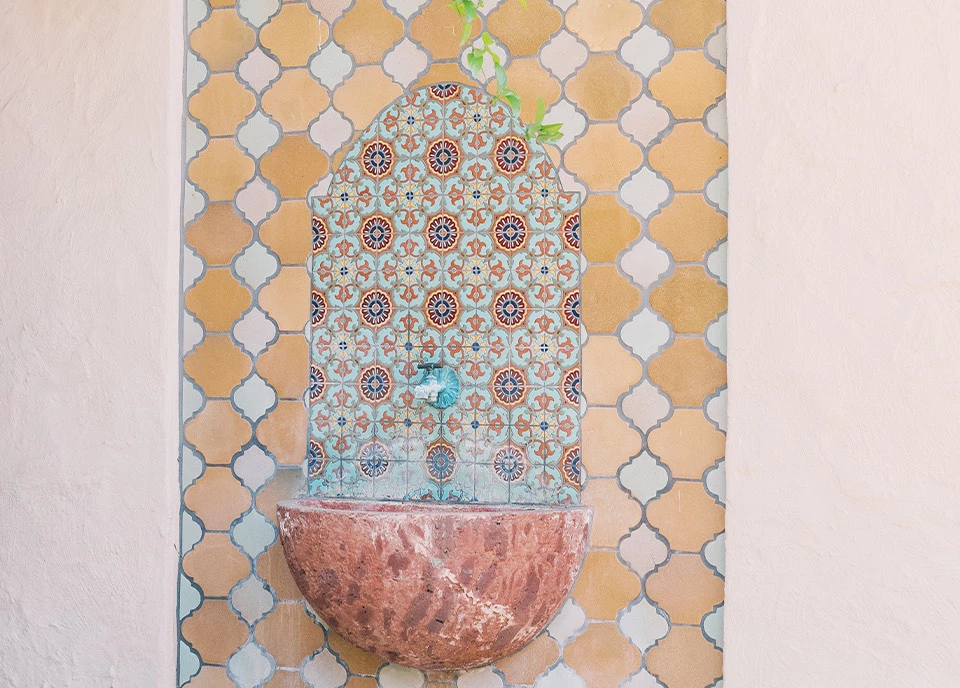 a colorful vase on a wall