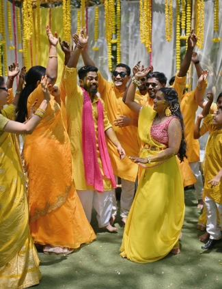 a group of people in yellow dresses