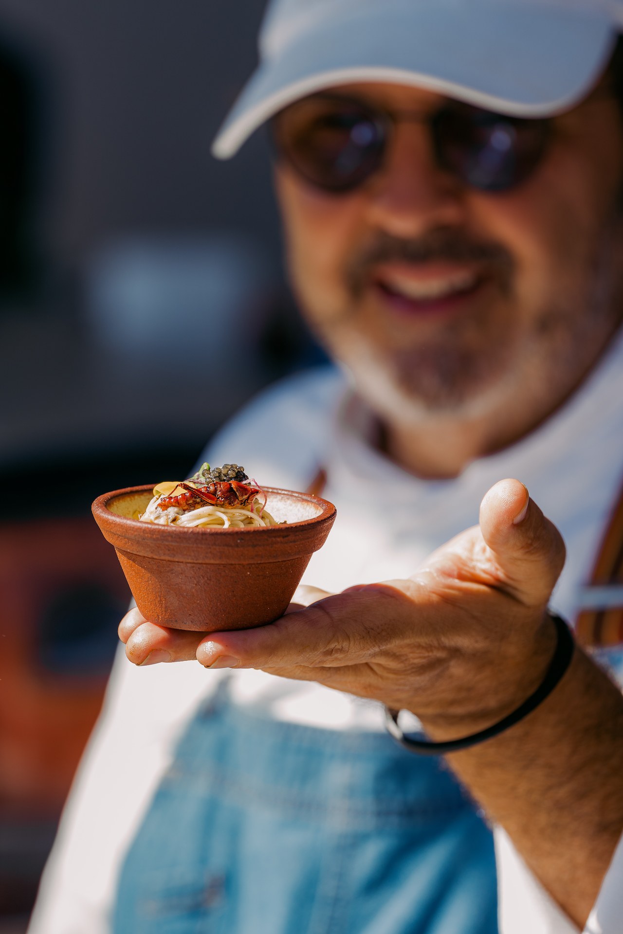 a man holding a bowl of food