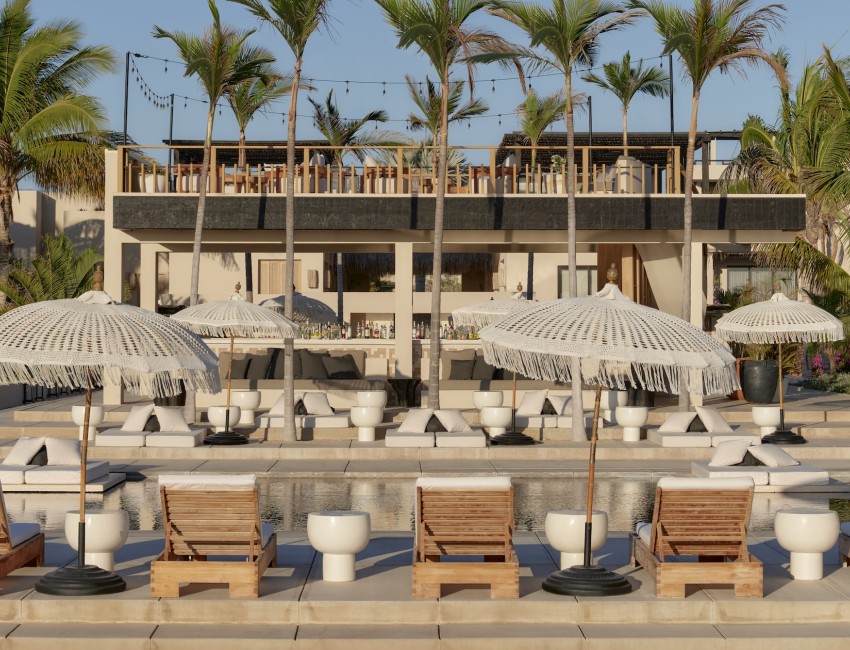 a pool with umbrellas and chairs