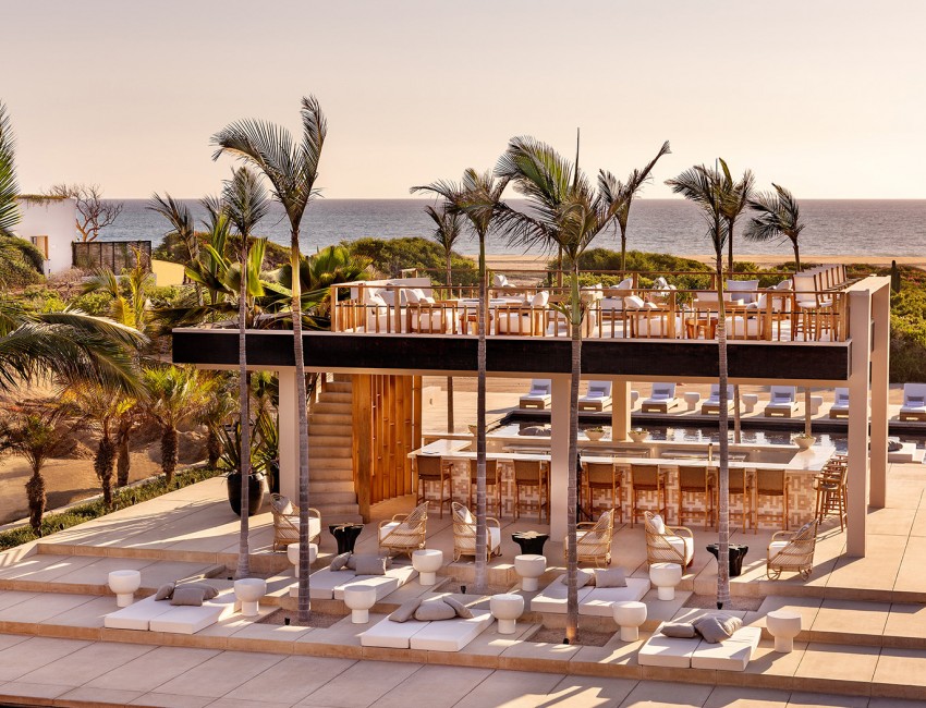 Ariel view of an outdoors restaurant with an ocean view