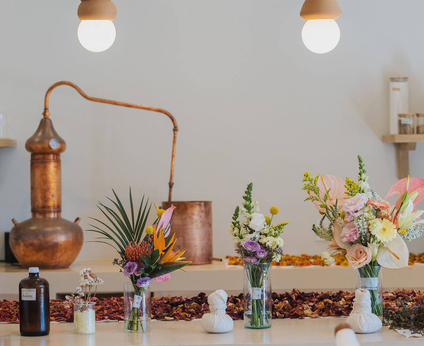 a group of flowers in vases on a table