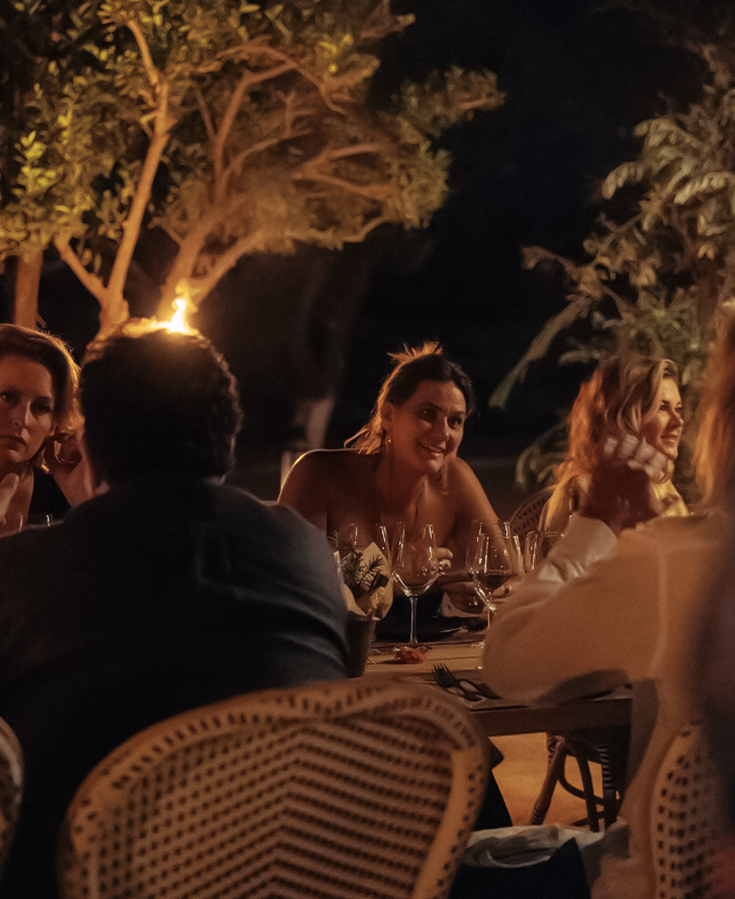 a group of people sitting at a table