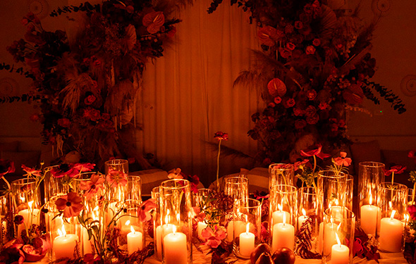 a table with candles and flowers