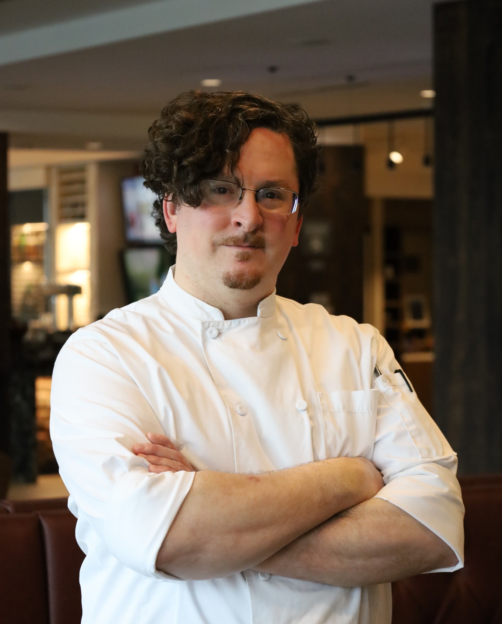 a man in a white chef coat