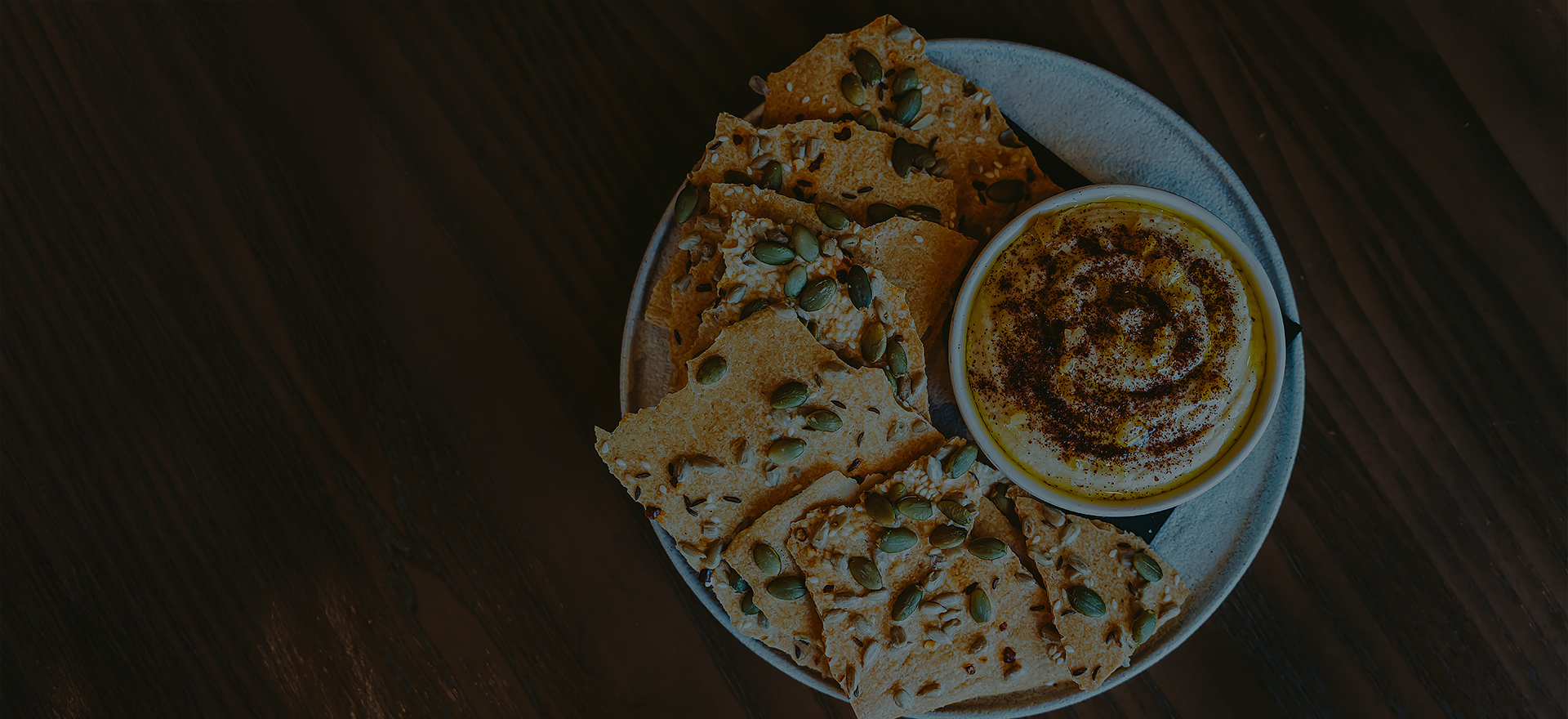 a plate of crackers and dip