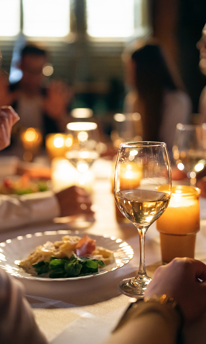 a glass of wine on a table