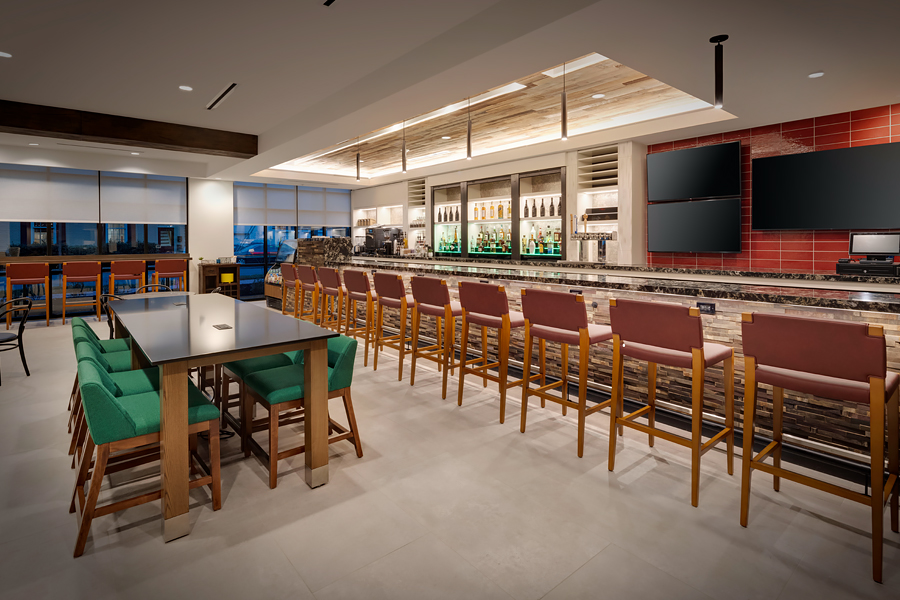 a bar with a table and chairs