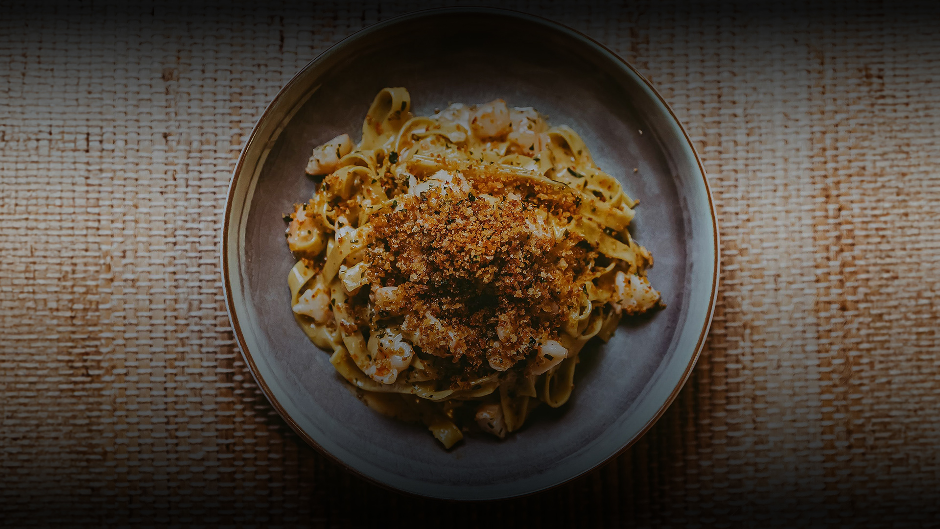 a plate of pasta with food on it