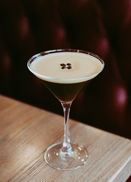 a glass with a drink in it