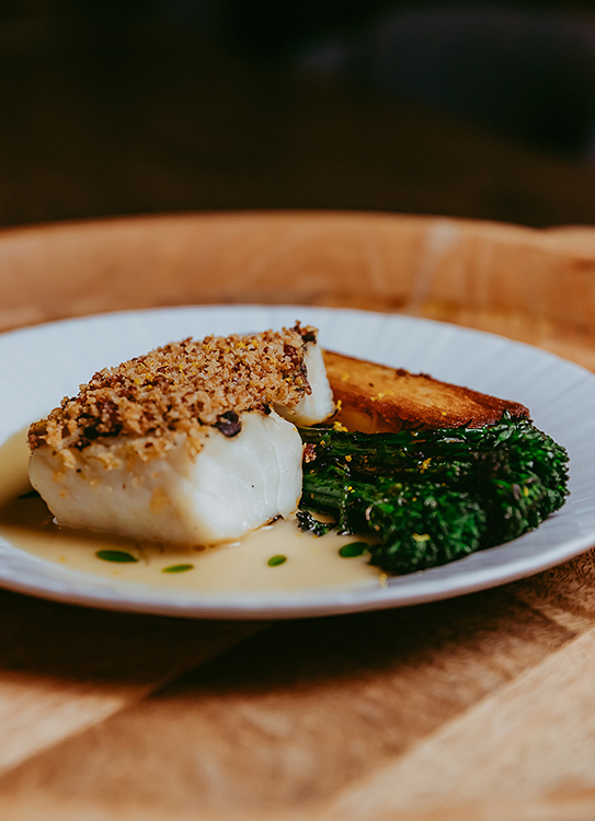 a plate of food on a wooden surface