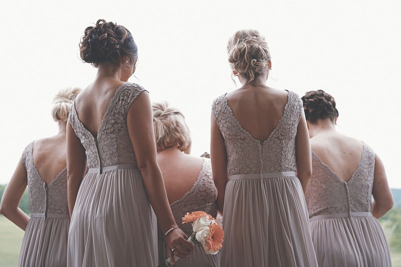 a group of women in dresses