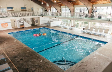 a pool with two people in it