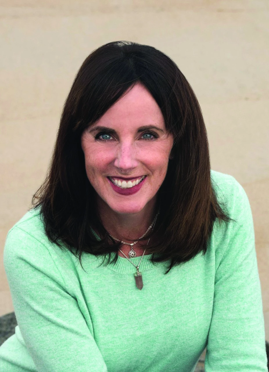 a woman smiling at the camera