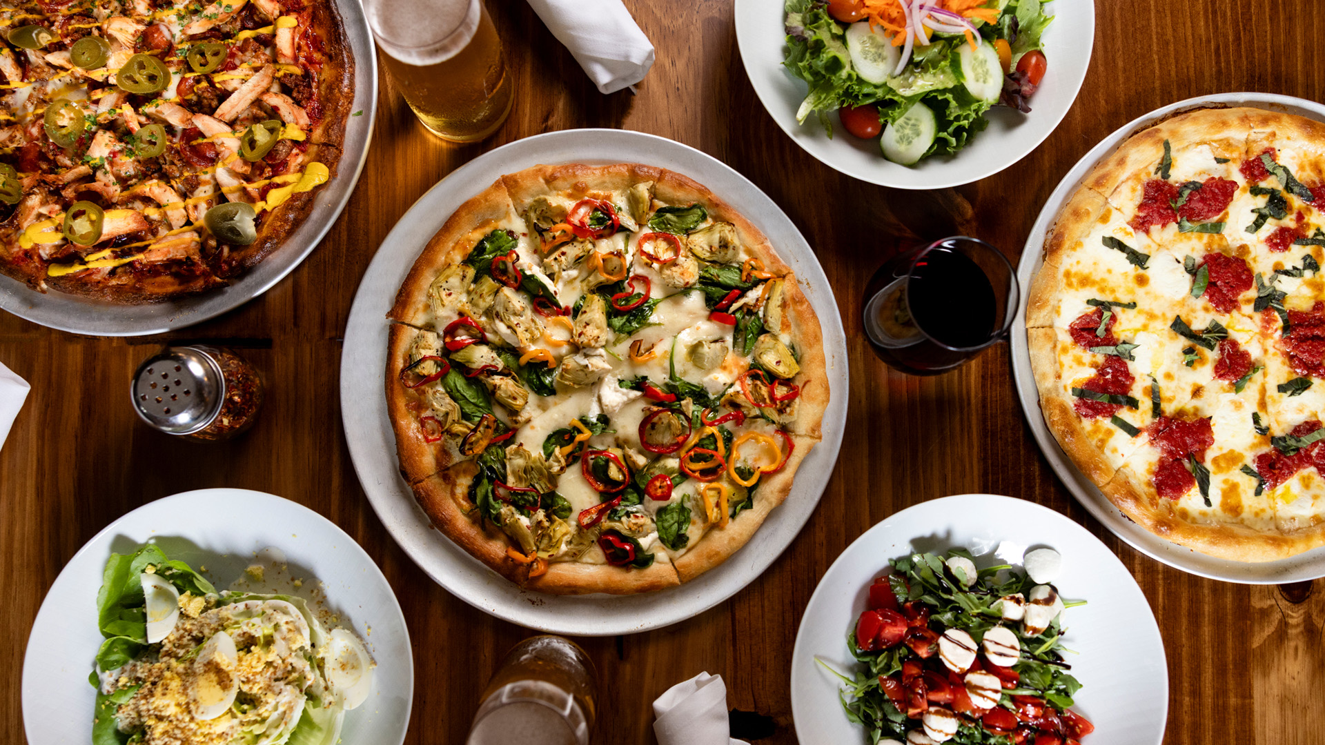 a table with plates of food and drinks