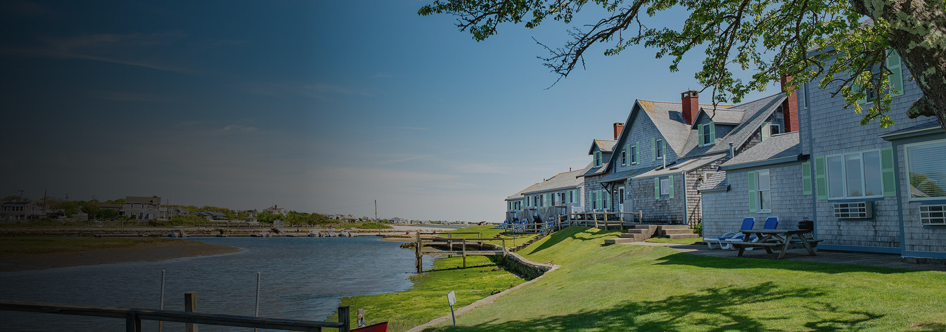 a row of houses next to a body of water