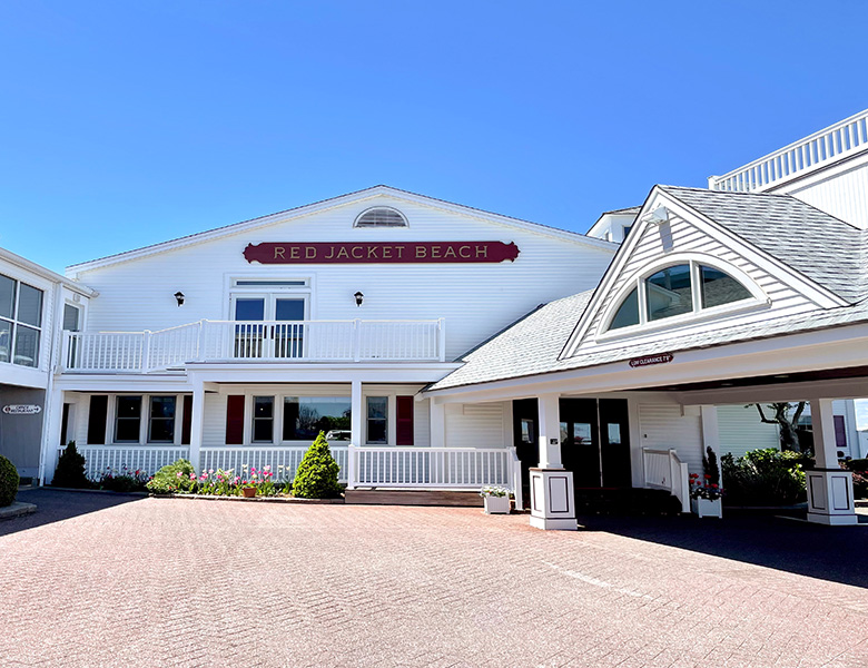 a white building with a red sign