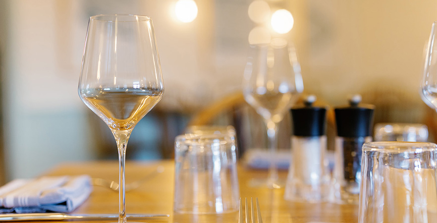a glass of wine on a table