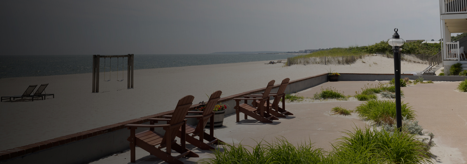 a group of chairs on a beach