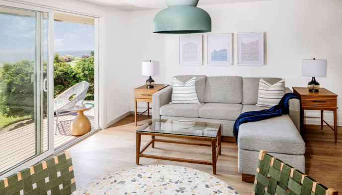 a living room with a couch and a glass table
