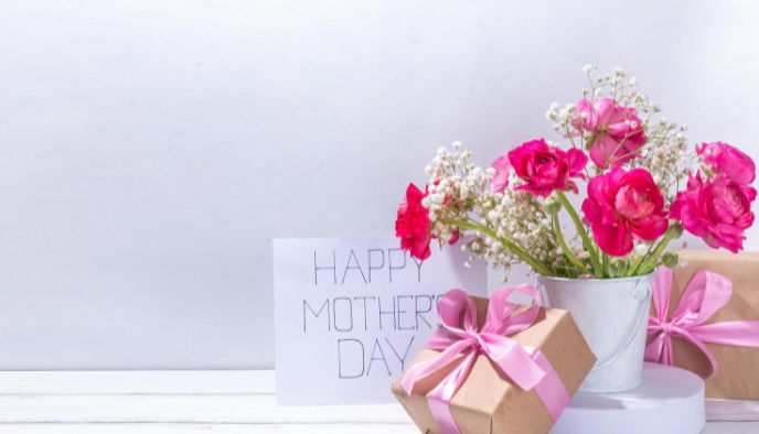 a bouquet of flowers and a gift